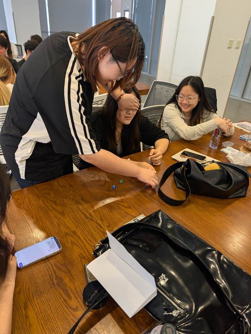 Students testing a game prototype with one player blindfolded