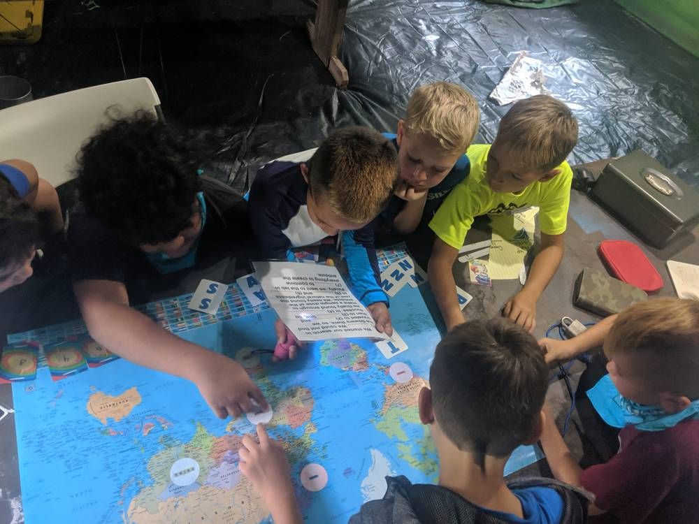 Children working together on a map puzzle